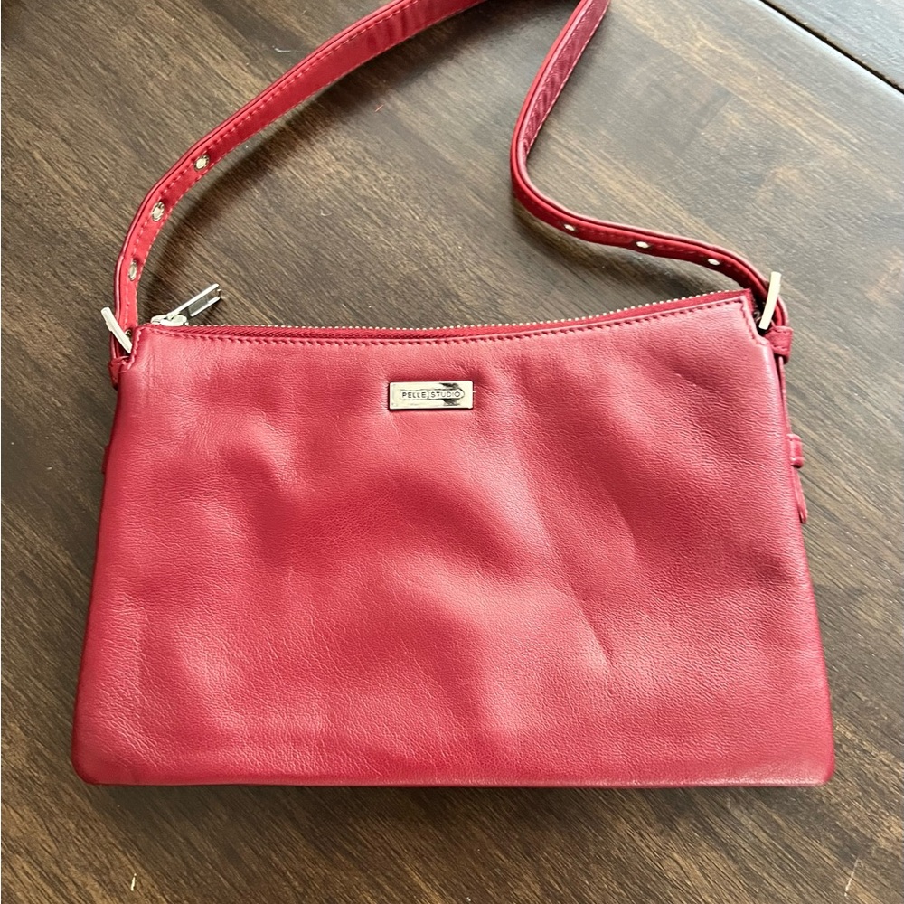 Wilsons Leather Burgundy Crossbody Bag.  Never used. Non smoking home.